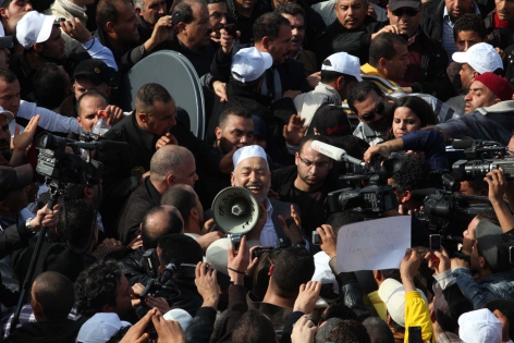  TUNISIA, Tunis : Rached Ghannouchi, the leader of Tunisia's Islamist movement Ennahdha arrives at the Tunis-Carthage airport after 22 years in exile on January 30, 2011 in Tunis. After the ousting of his arch-enemy Zine El Abidine Ben Ali he returned to Tunisia today eyeing a political role for his Ennahda movement in a country that is breaking free of the tight controls imposed by the former regime. Ons Abid