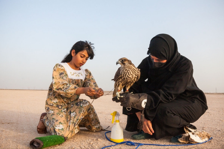  UNITED ARAB EMIRATES, ABU DHABI : Ayesha Matar Al Mansoori, a female falconer from a young age, pose with her daughter Osha Al Mansouri during her training of Falconies, in Abu Dhabi Falconers club ( Club de fauconnerie d?Abu `Dhabi, in Abu Dhabi, United Arab Emirates, Sunday, March. 18, 2021. ? Ons Abid